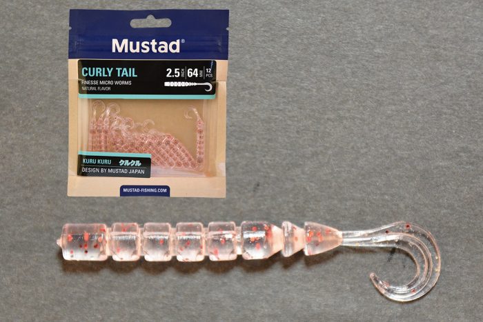 MUSTAD AJI CURLY TAIL 2.5   UV CLEAR RED GLITTER 12DB/CSOMAG